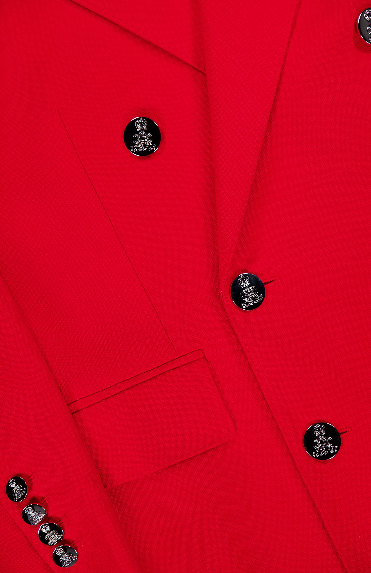 Close-up of the Camden Cashmere Jacket by RALPH LAUREN COLLECTION—a vibrant red, double-breasted blazer with shiny silver buttons, a neatly stitched front pocket, and smooth, finely textured fabric.