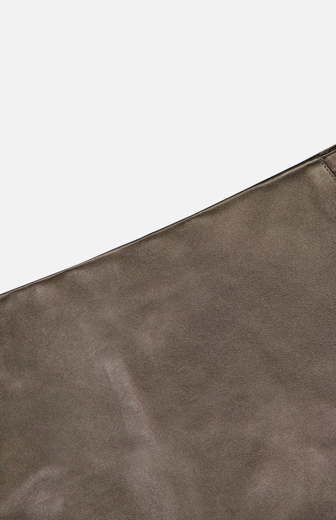 A detailed close-up of the Carreen Leather Mini Pencil Skirt by RALPH LAUREN COLLECTION, showcasing the rich brown lambskin leather fabric with visible texture and precise stitching, set against a plain white background.