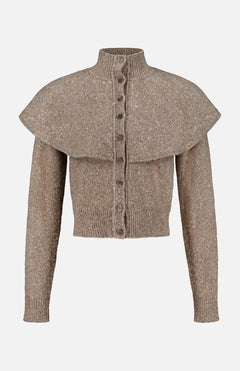 The Cashmere Turtleneck Cardigan Sweater by RALPH LAUREN COLLECTION is a taupe, knit long-sleeve piece featuring a high collar, front buttons, and a wide cape overlay across the shoulders.