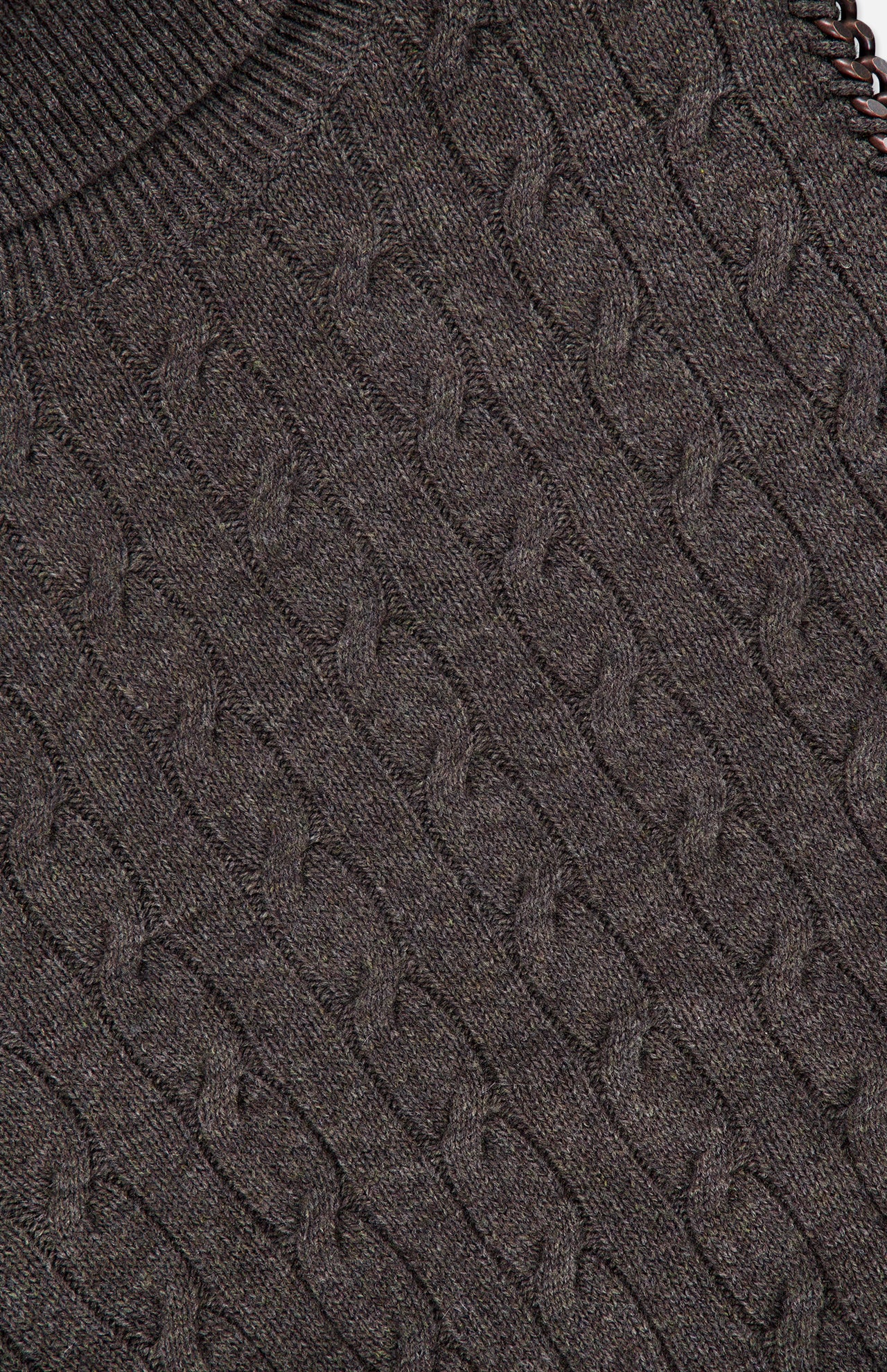 Close-up of the RALPH LAUREN COLLECTION Cashmere Turtleneck Sleeveless Sweater, highlighting its brown cable-knit design with a repeating braided pattern and ribbed neckline.