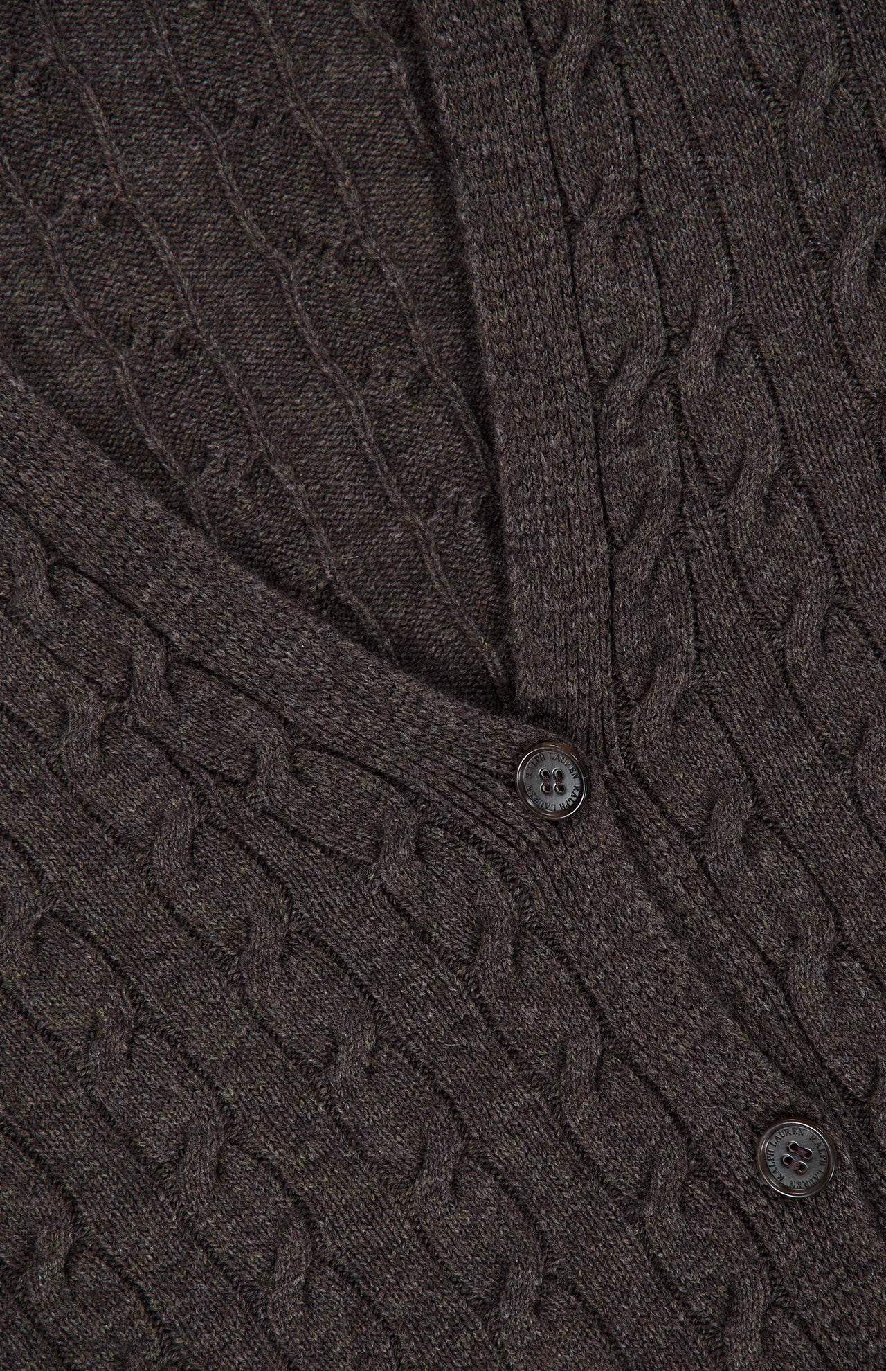 Close-up of a dark brown RALPH LAUREN COLLECTION Cashmere V-Neck Cardigan Sweater featuring a cable-knit pattern and matching buttons.