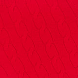 Close-up of the Classic Cashmere Short Sleeve Pullover Sweater by RALPH LAUREN COLLECTION, featuring bright red cable-knit fabric, a ribbed neckline, and a purple label at the collar. Made in Italy for a refined look.