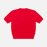 The Classic Cashmere Short Sleeve Pullover Sweater by RALPH LAUREN COLLECTION is a bright red, cableknit piece made in Italy and shown laid flat on a white background.