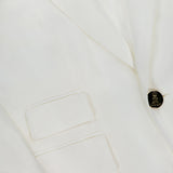 Close-up of the RALPH LAUREN COLLECTION Classic Linen Parker Blazer, featuring an off-white hue, two front pockets, a single black button closure, and four metallic sleeve buttons. Smooth fabric and modern slim fit tailoring.
