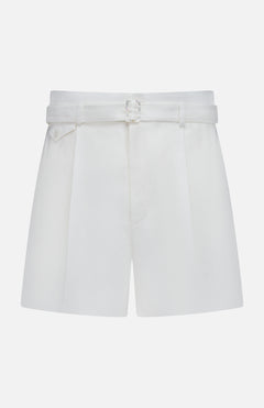 The Denise Classic Linen Shorts by RALPH LAUREN COLLECTION are high-waisted cream shorts with a matching belt and front pleats, ideal for summer suiting and shown against a plain white background.