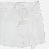 The Denise Classic Linen Shorts by RALPH LAUREN COLLECTION, styled partially unzipped, have a button closure, waist belt with loops, and visible inner lining—ideal for summer suiting—displayed on a plain white background.