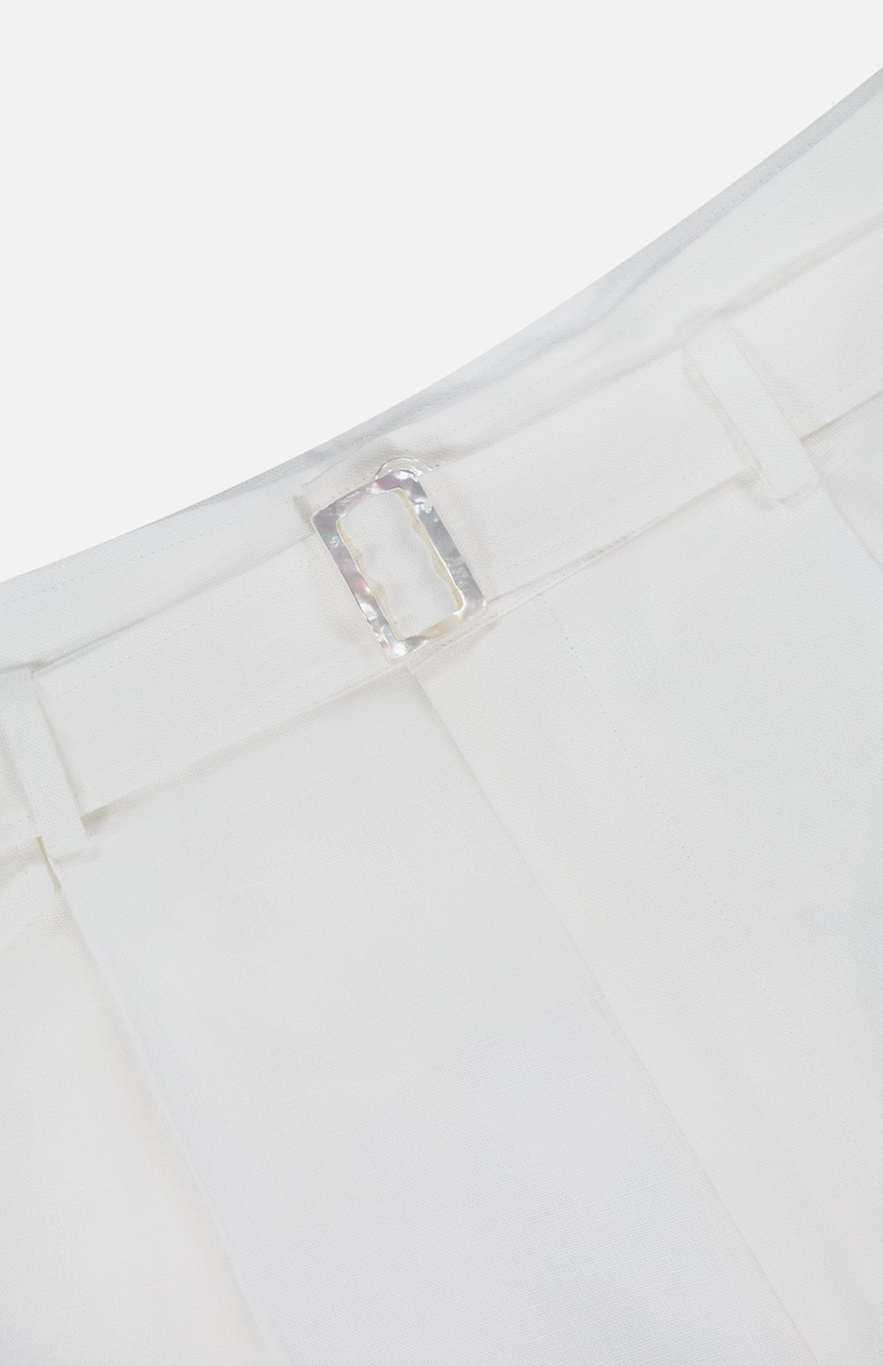 Close-up of the waistband of Denise Classic Linen Shorts by RALPH LAUREN COLLECTION, featuring belt loops and a clear rectangular buckle. The lightweight, textured linen is ideal for summer suiting or versatile warm-weather styling.