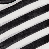 Close-up of the Easy Long Sleeve Silk Linen Sweater by RALPH LAUREN COLLECTION, showcasing black and white horizontal stripes, a visible neckline, a purple Ralph Lauren label, and crafted from a luxurious silk-linen blend.