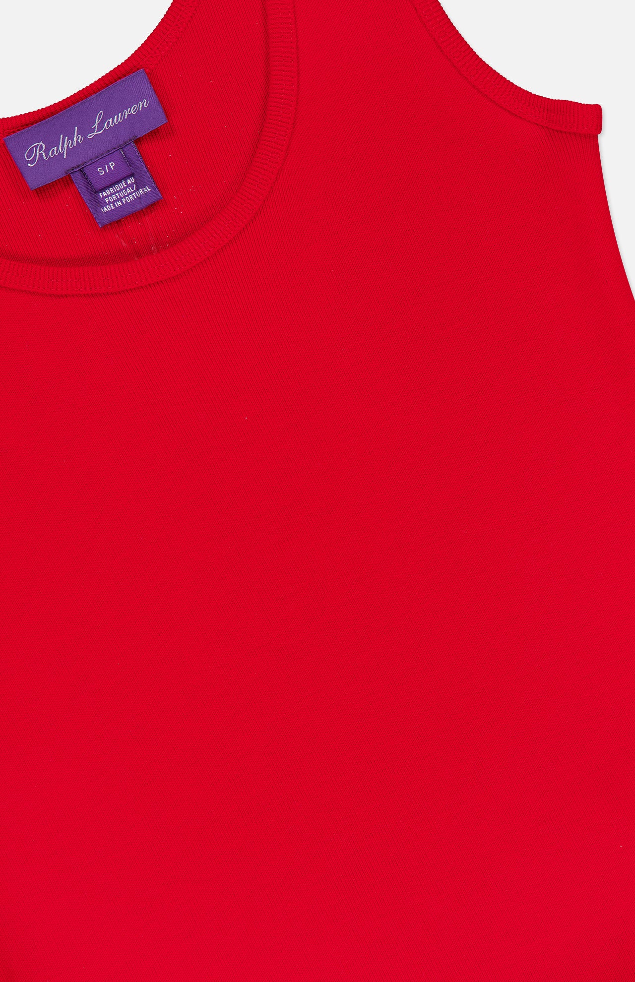 Close-up of the Ellis Cotton Knit Rib Tank Top by RALPH LAUREN COLLECTION, featuring bright red rib-knit fabric, a ribbed neckline, and an inside label with "RALPH LAUREN COLLECTION" in white on purple plus sizing info below.
