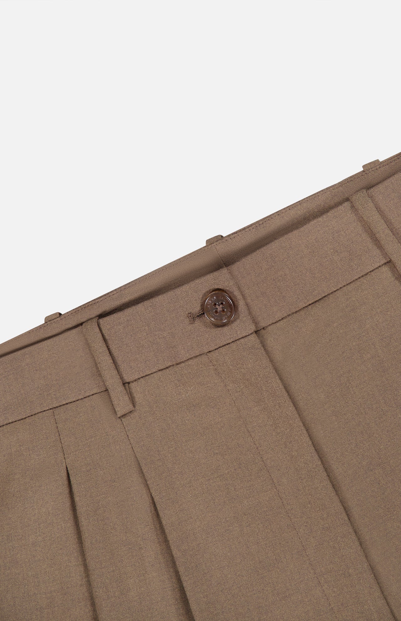 Close-up of the Fine Wool Standard Pants by RALPH LAUREN COLLECTION, crafted from stretch-wool fabric in brown, highlighting the waistband, belt loops, button closure, and a portion of the zipper fly against a white background.