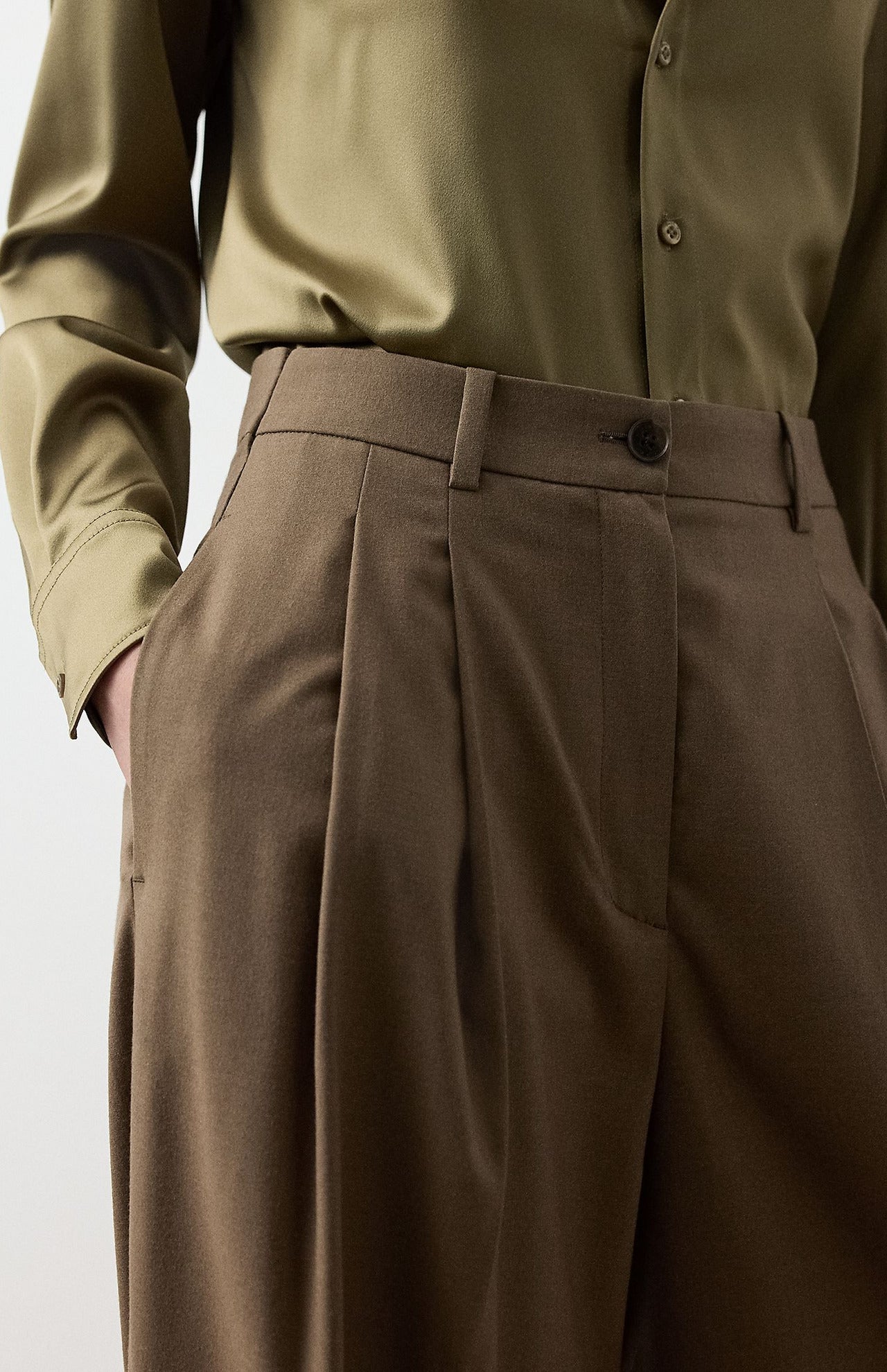 Ralph Lauren Collection Fine Wool Standard Pants in brown, featuring a relaxed-fit, high waist, single front pleat, and side pockets, worn with an olive button-down shirt.