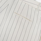 Close-up of the back of the Harlo Pleated Stripe Suit Pants by RALPH LAUREN COLLECTION, featuring off-white cotton-blend fabric with thin black pinstripes, a single welt pocket, and belt loops.