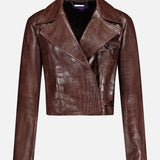 The Jaxson Leather Moto Jacket from the RALPH LAUREN COLLECTION is a cropped brown lambskin design with an eye-catching crocodile-embossed pattern, long sleeves, wide lapels, and an asymmetrical button closure—exuding the timeless sophistication of Ralph Lauren. Shown against a plain white background.