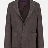 The Jersey Knit Blazer from RALPH LAUREN COLLECTION features a brown checkered pattern, two front patch pockets, a notch lapel, two-button closure, and a chest pocket. Displayed on a plain white background, this Italian-made blazer blends classic design with refined craftsmanship.