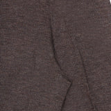 Close-up of brown textured fabric with visible stitching, likely part of a sleeve and shoulder seam on a garment—set against a white background—an ideal pairing with the Jersey Knit Standard Straight Pants from RALPH LAUREN COLLECTION for a refined ensemble.