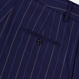 Close-up of the Jody Pleated Trouser Pant by RALPH LAUREN COLLECTION in navy pinstripe ultrafine wool crepe, featuring a high rise, single buttoned back pocket, belt loops, and precisely stitched seams.