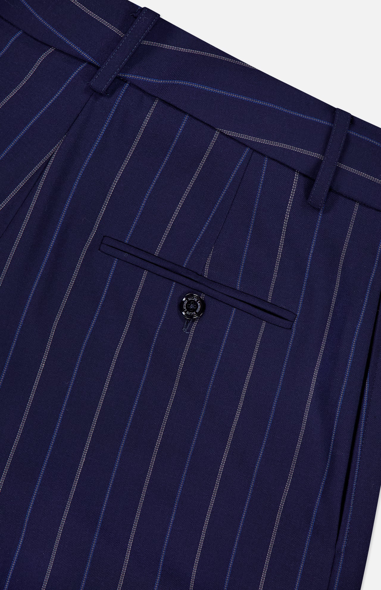 Close-up of the Jody Pleated Trouser Pant by RALPH LAUREN COLLECTION in navy pinstripe ultrafine wool crepe, featuring a high rise, single buttoned back pocket, belt loops, and precisely stitched seams.