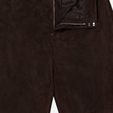 Close-up of the Keegan Suede Full Length Pant by RALPH LAUREN COLLECTION—mid-rise, straight leg lamb suede with a partially open zipper, visible button and hook fasteners at the waistband, and inside lining. Made in Italy.