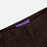 Close-up of the waistband on Keegan Suede Full Length Pant by RALPH LAUREN COLLECTION in dark brown lamb suede, mid-rise with straight leg. Features a visible purple label inside. Made in Italy, shown against a plain white background.