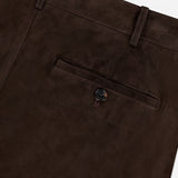 Close-up of the back pocket on the Keegan Suede Full Length Pant by RALPH LAUREN COLLECTION, in dark brown lamb suede with button closure and belt loops; mid-rise, straight leg, expertly crafted in Italy.