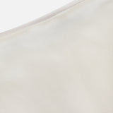 A close-up of light beige satin with a smooth, lustrous texture and seam detail—perfect for the Masina Lux Satin Maxi Skirt by RALPH LAUREN COLLECTION.