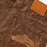 Close-up of the back of Mercer Cotton Denim Full Length Wide Pant from RALPH LAUREN COLLECTION, showcasing a wide-leg silhouette, large back pocket, belt loop, and tan leather patch with embossed branding near the waistband.