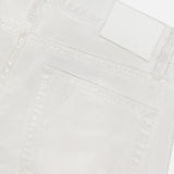 Close-up of the back pocket and waistband of Mercer Wide Leg Jeans by RALPH LAUREN COLLECTION, featuring eco stone-washed white denim with stitching details, belt loops, and a blank white label.