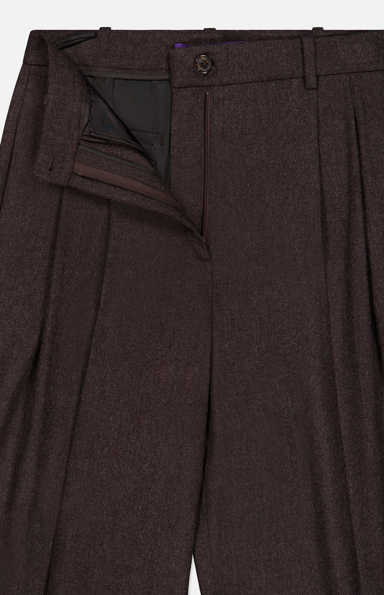 A close-up view of the RALPH LAUREN COLLECTION Mini Herringbone Standard Pants in dark brown, with the zipper and button fly open, highlighting the pleats and part of the waistband.
