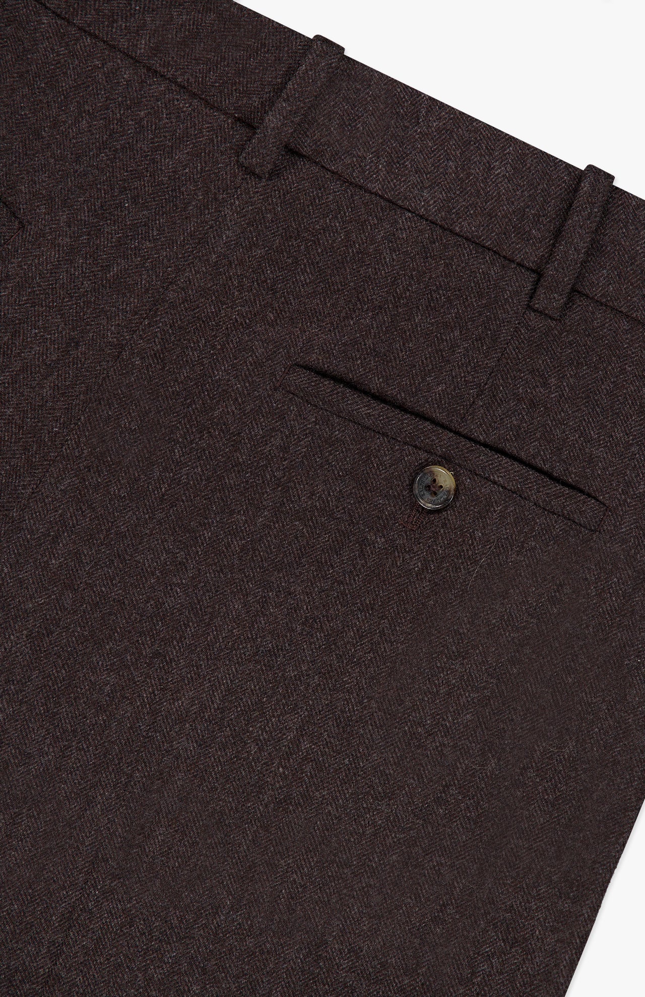 Close-up of the RALPH LAUREN COLLECTION Mini Herringbone Standard Pants in dark brown, showcasing a waistband with belt loops and a back pocket fastened with a single button.