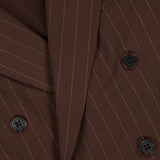Close-up of the Ramona Wide Stripe Blazer by RALPH LAUREN COLLECTION, featuring dark brown wool with white pinstripes, dark buttons, a notched lapel, and a smooth tailored finish that emphasizes its double-breasted classic style.