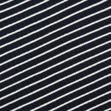 A close-up of the RALPH LAUREN COLLECTION Ribbed Striped Turtleneck Sweater showcases its navy and white stripes and textured pattern.