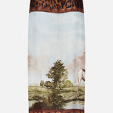 Crafted in Italy from luxurious silk twill, the Scenic Silk Twill Pencil Skirt by RALPH LAUREN COLLECTION features a central landscape print with a tree and horse, framed by bold leopard print and intricate floral borders at the top and bottom.