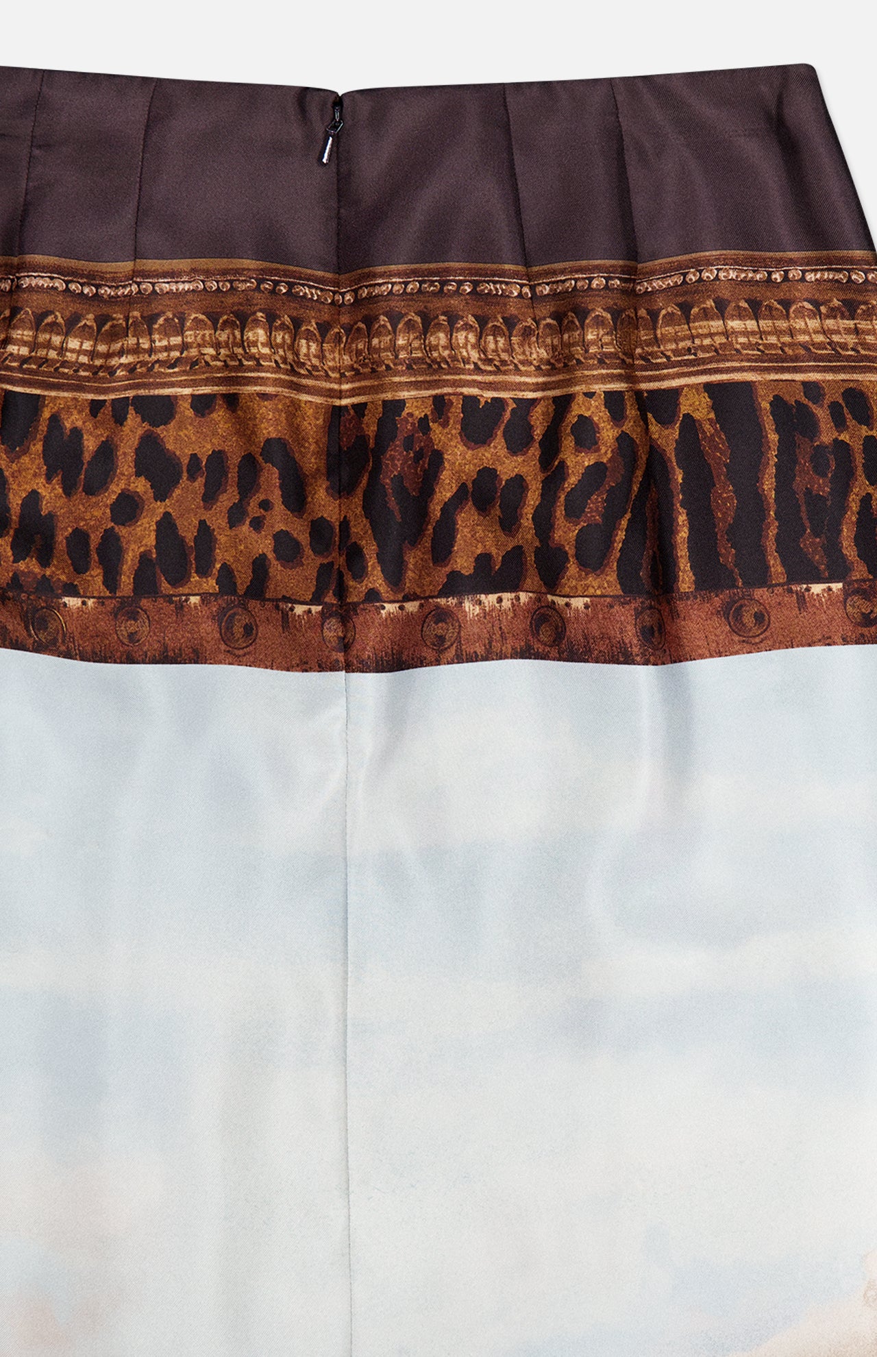 A close-up of the RALPH LAUREN COLLECTION Scenic Silk Twill Pencil Skirt, showcasing its brown waistband, leopard print strip, light blue lower section, and back zipper detail. Expertly crafted in Italy, this chic skirt exemplifies refined style.