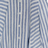 Close-up of the Shamus Linen Umbrella Stripe Maxi Skirt by RALPH LAUREN COLLECTION, featuring blue and white stripes, front white buttons, and pleated details—ideal for coastal-inspired style.