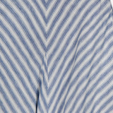 Close-up of the Shamus Linen Umbrella Stripe Maxi Skirt by RALPH LAUREN COLLECTION, featuring diagonal blue and white chevron stripes with a defined waistband—ideal for effortless coastal-inspired style.