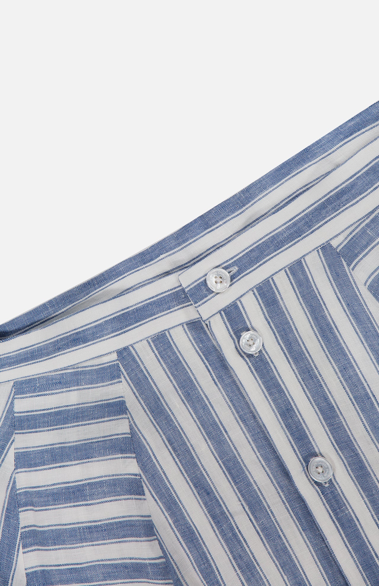 Close-up of the RALPH LAUREN COLLECTION Shamus Linen Umbrella Stripe Maxi Skirt in blue and white stripes, featuring a waistband with belt loops and three white buttons—crafted from lightweight linen for coastal style.