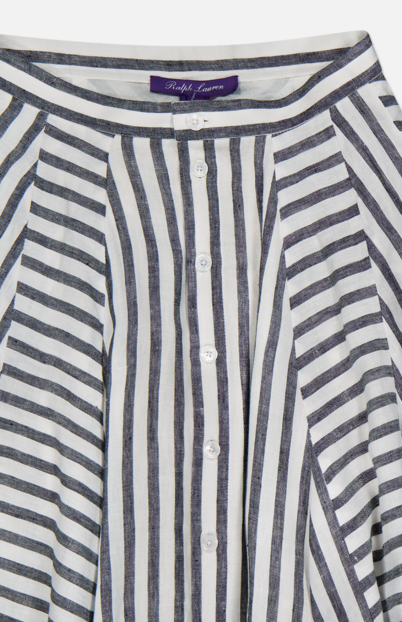 Close-up of the Shamus Umbrella Stripe Maxi Skirt by RALPH LAUREN COLLECTION, featuring blue and white vertical stripes, lightweight linen fabric, a Ralph Lauren label on the waistband, and white buttons.