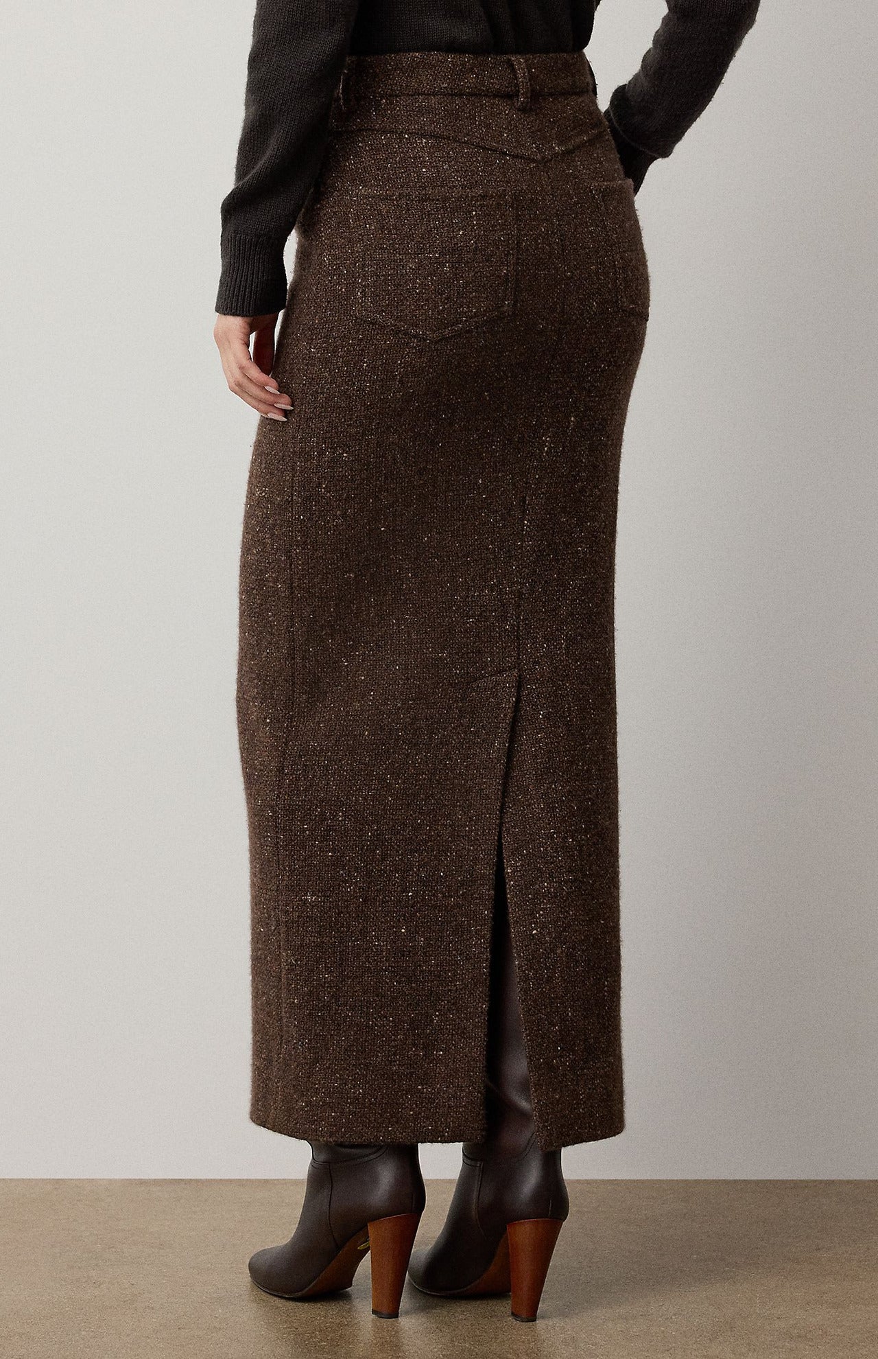A brown Ralph Lauren Collection Tweed Ankle Pencil Skirt with a back vent and belt loops, styled in wool cashmere and paired with dark boots.