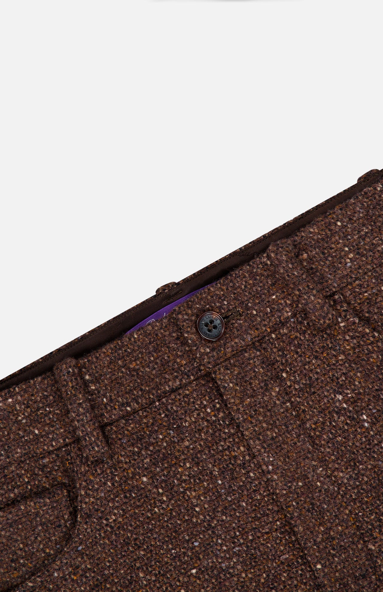 Close-up of the Tweed Ankle Pencil Skirt by RALPH LAUREN COLLECTION, featuring brown tweed fabric, a visible black button, belt loops, and a front pocket, set against a plain white background.