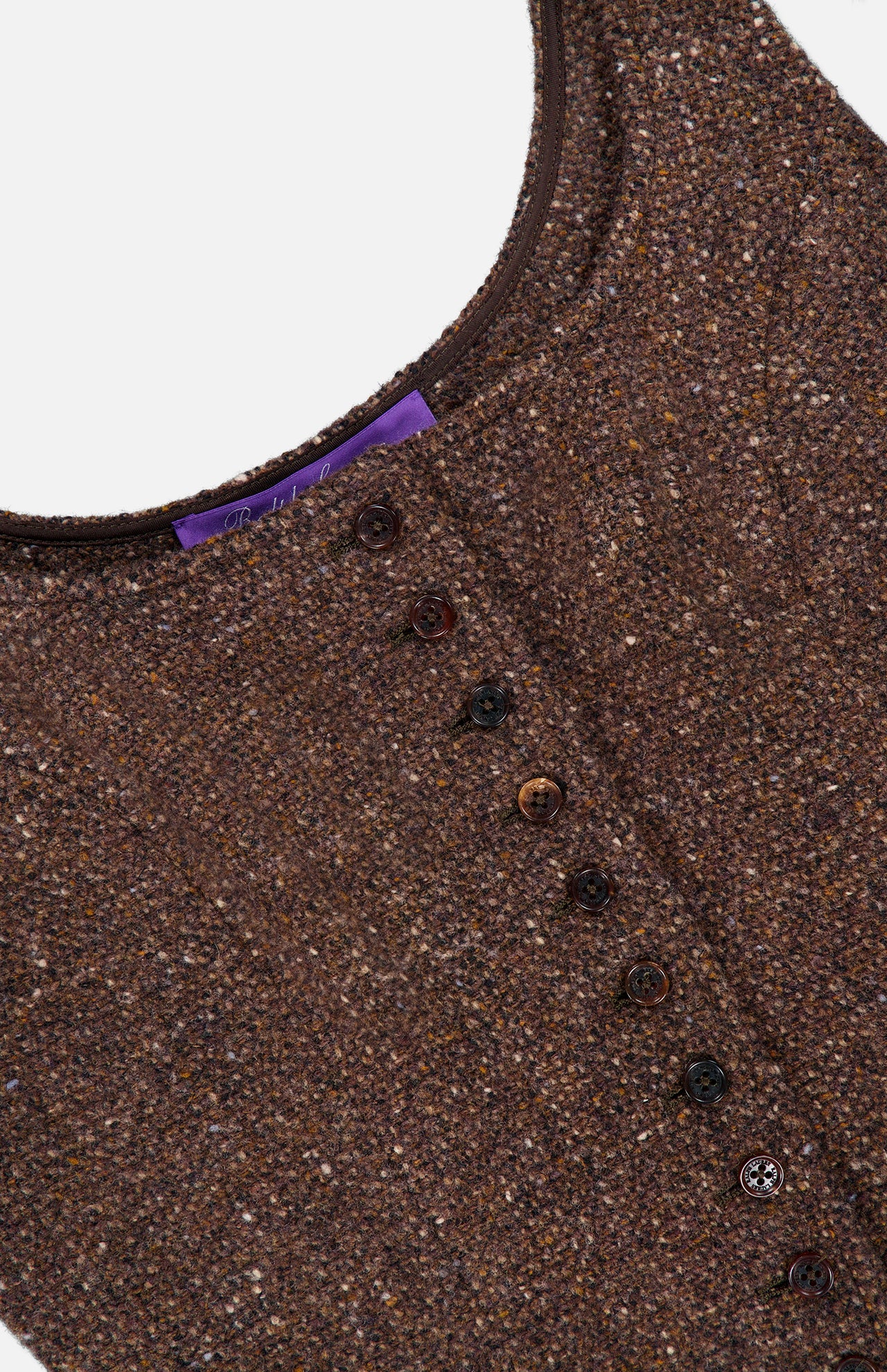 A close-up of the Tweed Scoop Neck Vest Top by RALPH LAUREN COLLECTION, showcasing its brown textured wool-cashmere blend fabric, dark front buttons, and a visible purple tag near the neckline. The sleeveless vest is laid flat on a white background.