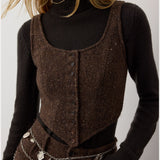 A person wearing a black turtleneck sweater layered under the RALPH LAUREN COLLECTION Tweed Scoop Neck Vest Top, paired with brown pants and a silver charm chain belt. Their face is partially out of frame.