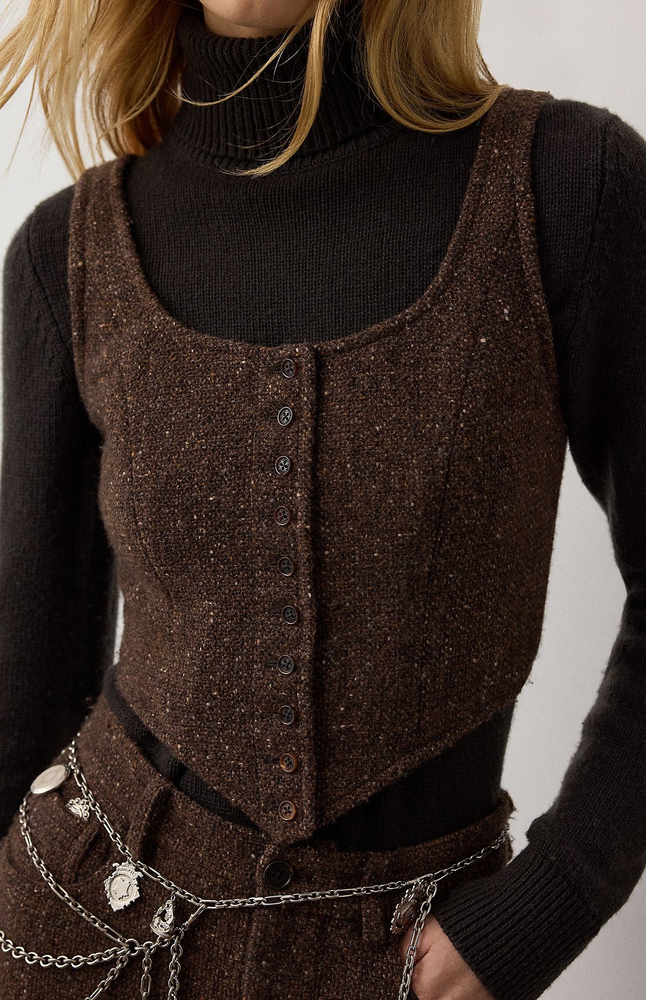 RALPH LAUREN COLLECTION Tweed Scoop Neck Vest Top in brown speckled tweed with a scoop neck and button-front closure, worn over a black turtleneck sweater.