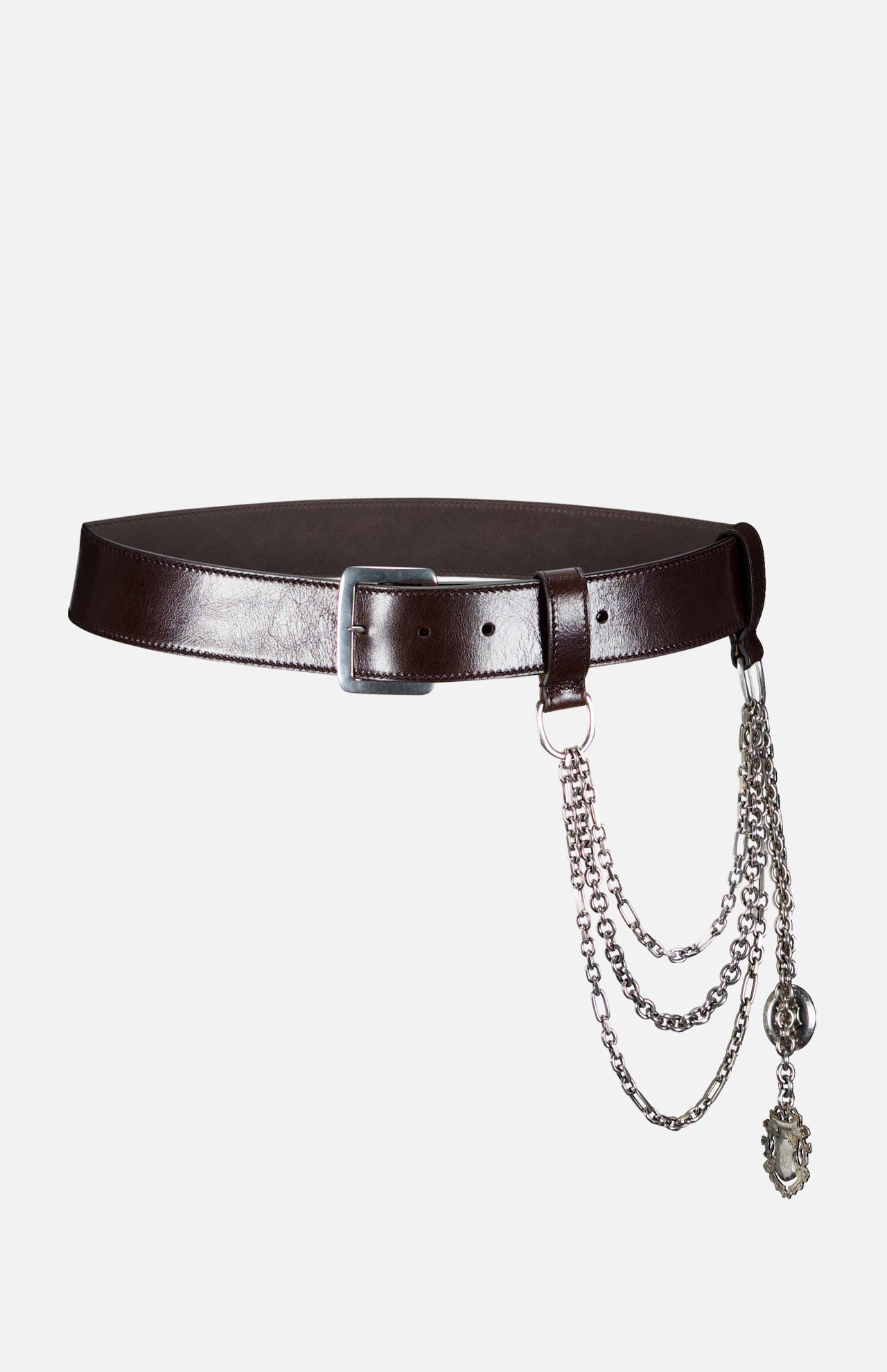 The Washed Calfskin Belt by RALPH LAUREN COLLECTION is a dark brown full-grain leather belt with a silver buckle, detailed with three silver chains and two pendants on one side.