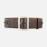 The Washed Calfskin Belt from RALPH LAUREN COLLECTION is expertly crafted from full-grain calfskin leather in a rich, dark brown shade. Featuring a large silver rectangular buckle and decorative metallic studs along the edges, this statement belt brings bold style to any outfit.