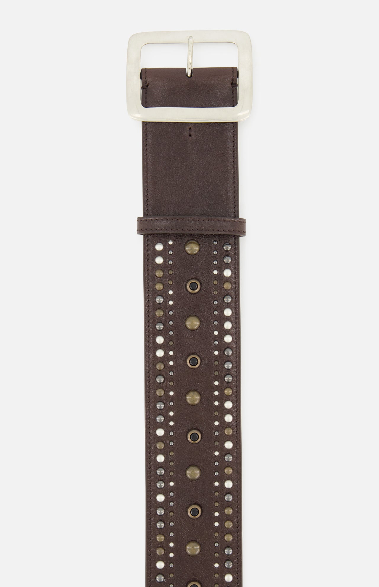 A close-up of the RALPH LAUREN COLLECTION Washed Calfskin Belt in rich brown, crafted from premium calfskin leather with a silver buckle and adorned with rows of metallic studs and brass eyelets down the center.
