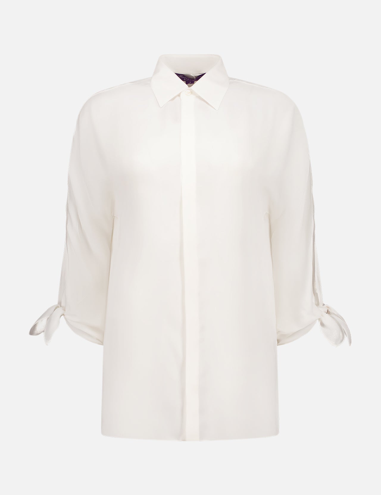 The Karen Blouse by RALPH LAUREN COLLECTION is an off-white Italian-made silk top with a classic collar, concealed buttons, and bow cuffs. Its loose fit lends a simple yet sophisticated style.