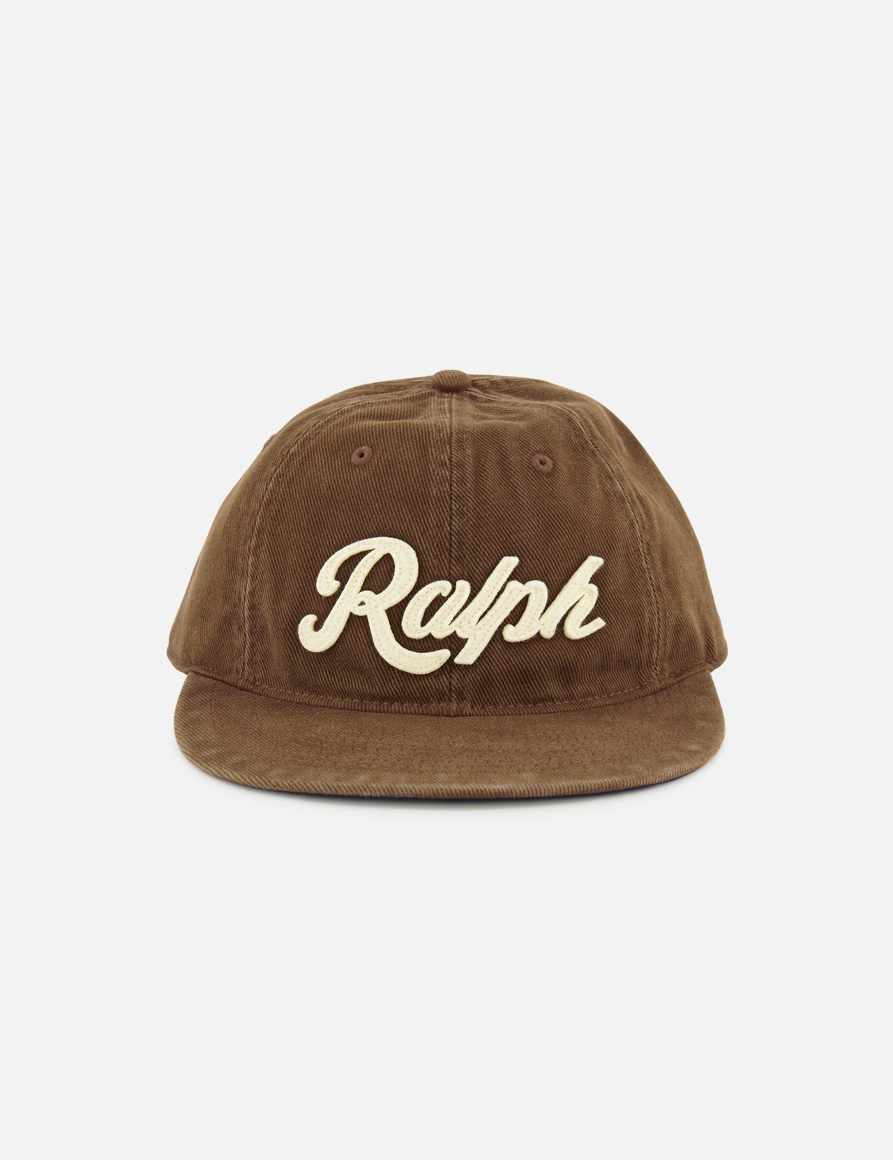 A brown cotton twill RALPH LAUREN POLO baseball cap featuring “Ralph” embroidered in large cream-colored script on the front, accented with classic logo embroidery and finished with an adjustable leather strap at the back.