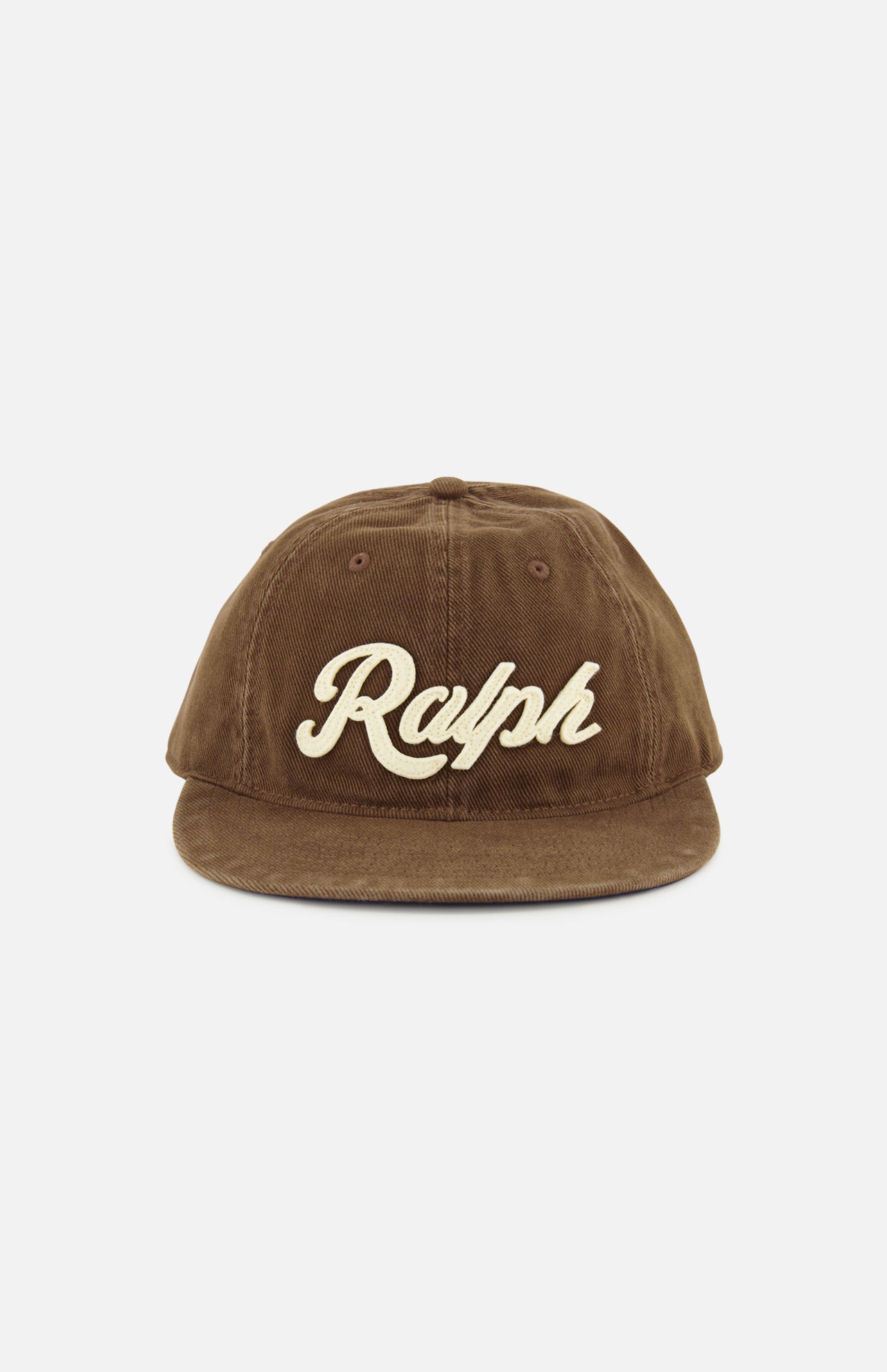A brown cotton twill RALPH LAUREN POLO baseball cap featuring “Ralph” embroidered in large cream-colored script on the front, accented with classic logo embroidery and finished with an adjustable leather strap at the back.