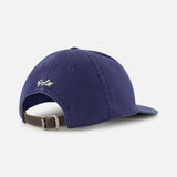 The Cotton Twill Baseball Cap by RALPH LAUREN POLO is displayed from the back in navy blue, highlighting a brown leather strap with a metal buckle and white embroidered RALPH LAUREN POLO branding above the opening.
