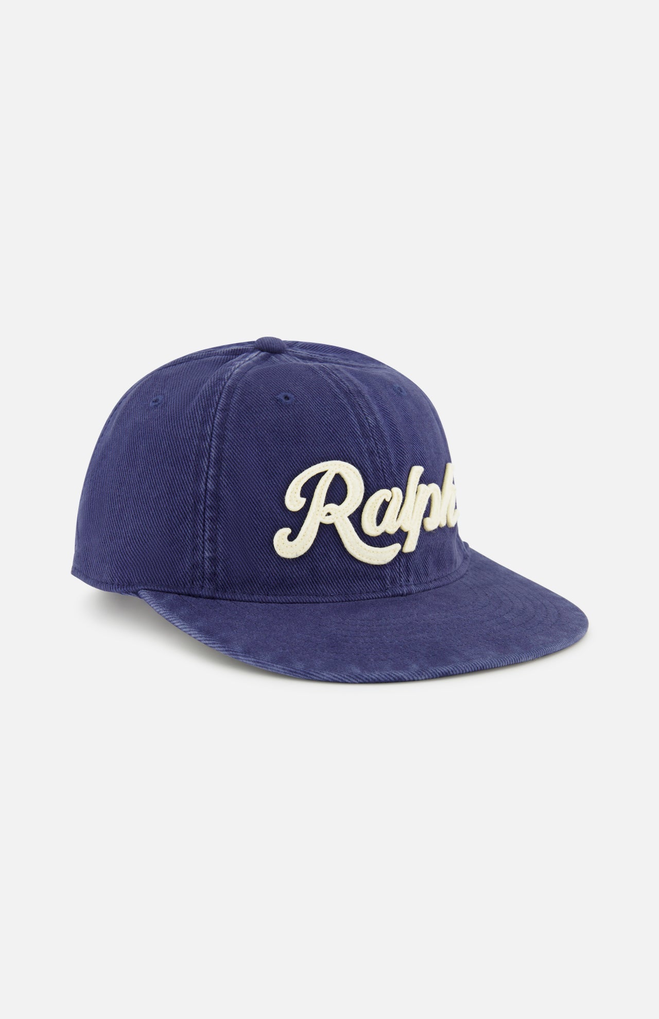 The Cotton Twill Baseball Cap by RALPH LAUREN POLO is a classic navy accessory, featuring “Ralph” elegantly embroidered in white cursive across the front. Designed for both style and comfort, it includes a premium leather strap at the back for an adjustable fit and is displayed on a plain white background to highlight its timeless appeal.